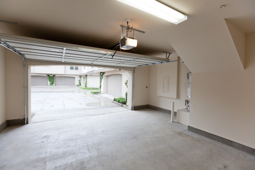 Empty garage with open door, looking from inside