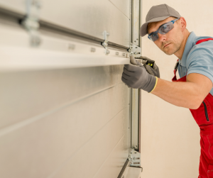 A garage door technician inspecting a garage door.