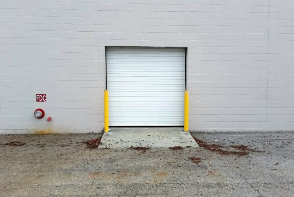 A Cookson service door on a cinderblock commercial building