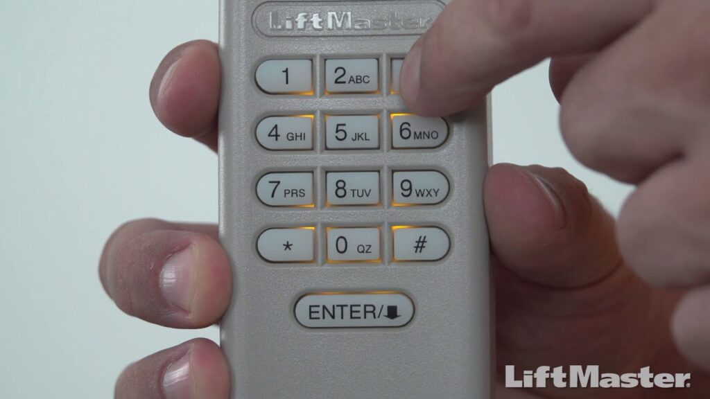A LiftMaster garage door opener remote, with somebody pressing its buttons